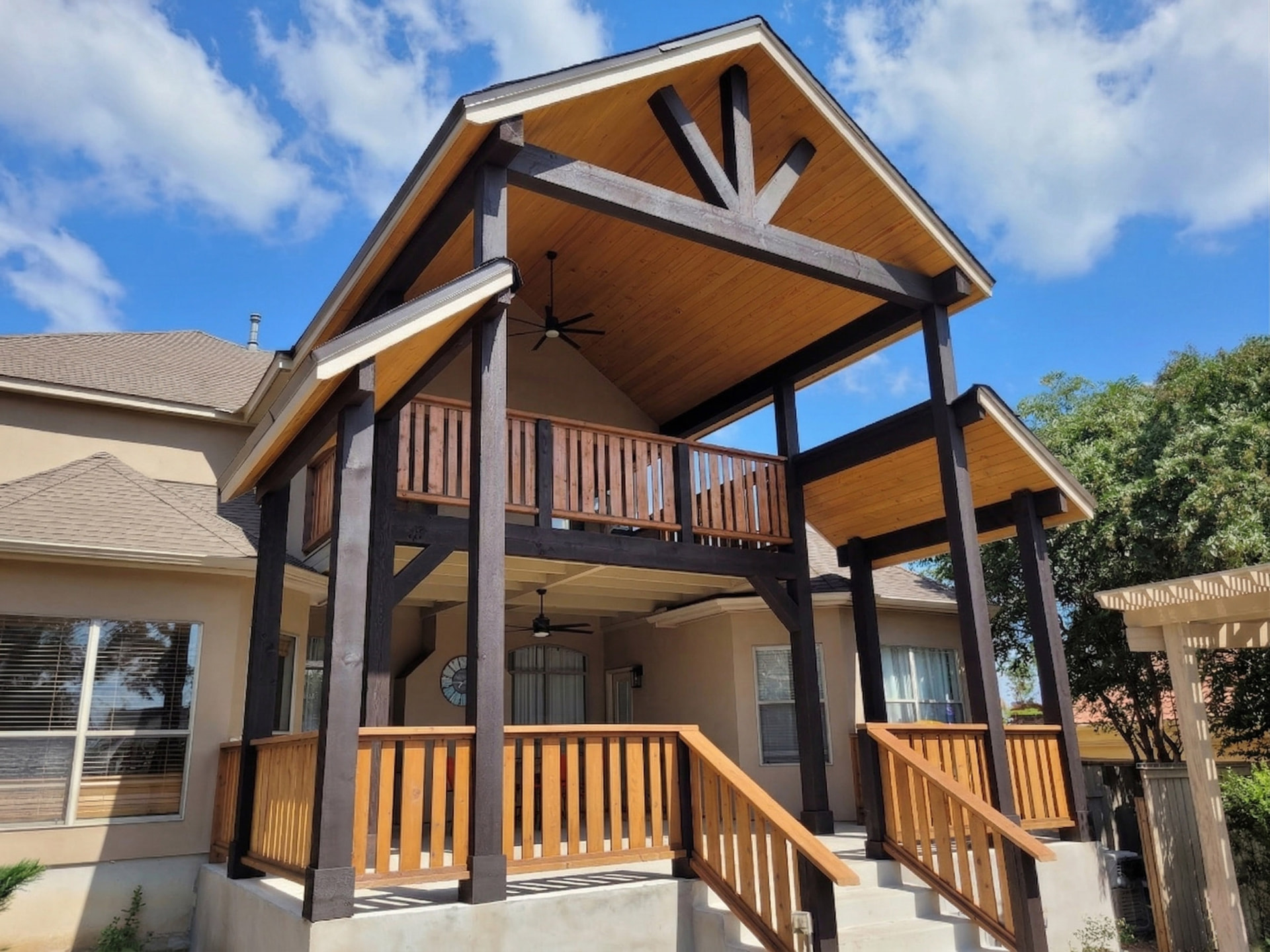 Freshly painted multi-level deck and exterior trim on a San Antonio home