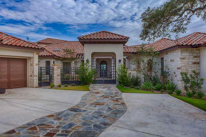 Exterior home painting with stone and stucco in San Antonio