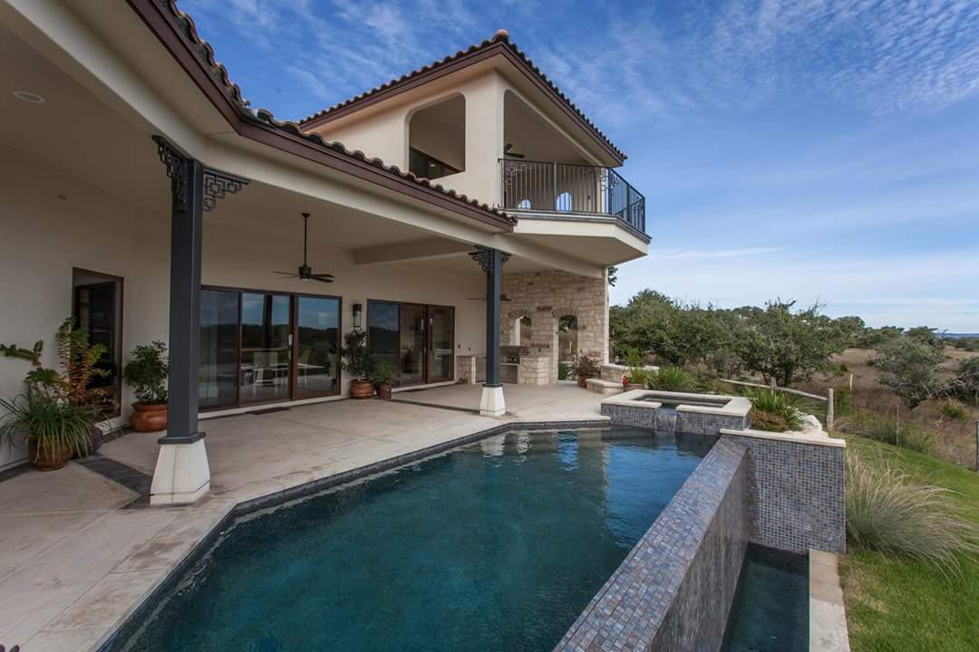 Exterior painting with pool area in San Antonio