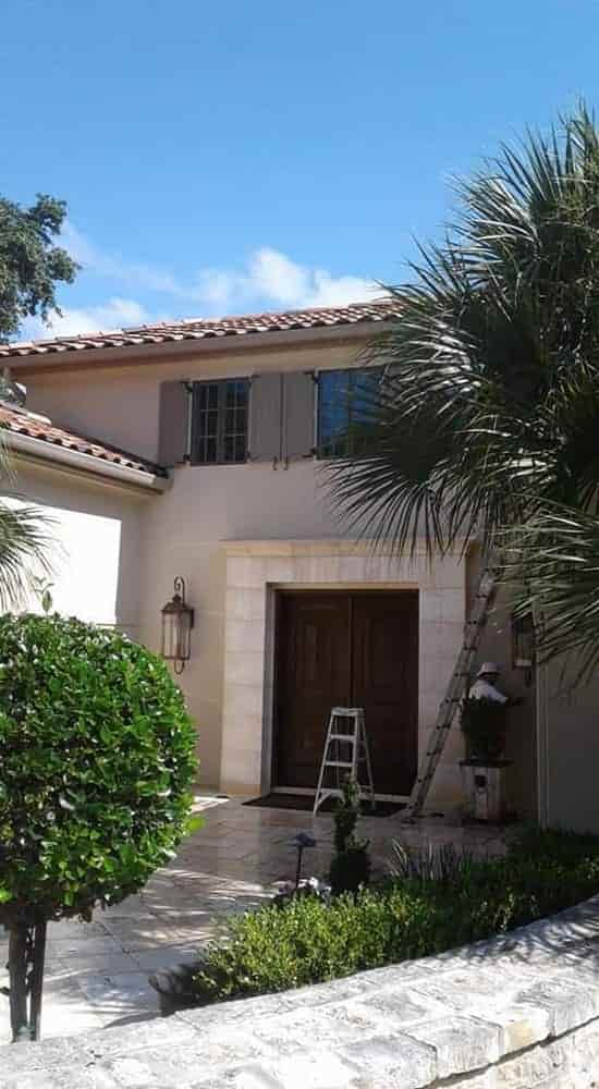 Exterior home painting with shutters in San Antonio