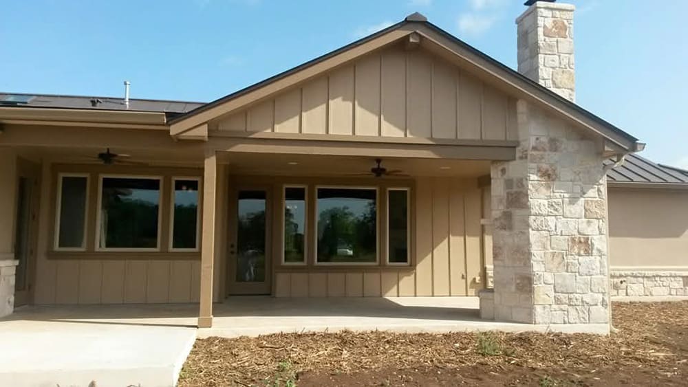 Exterior home painting with stone accents in San Antonio